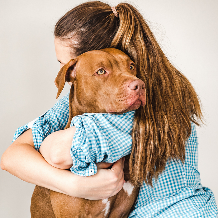 Woman hugging terminally ill dog