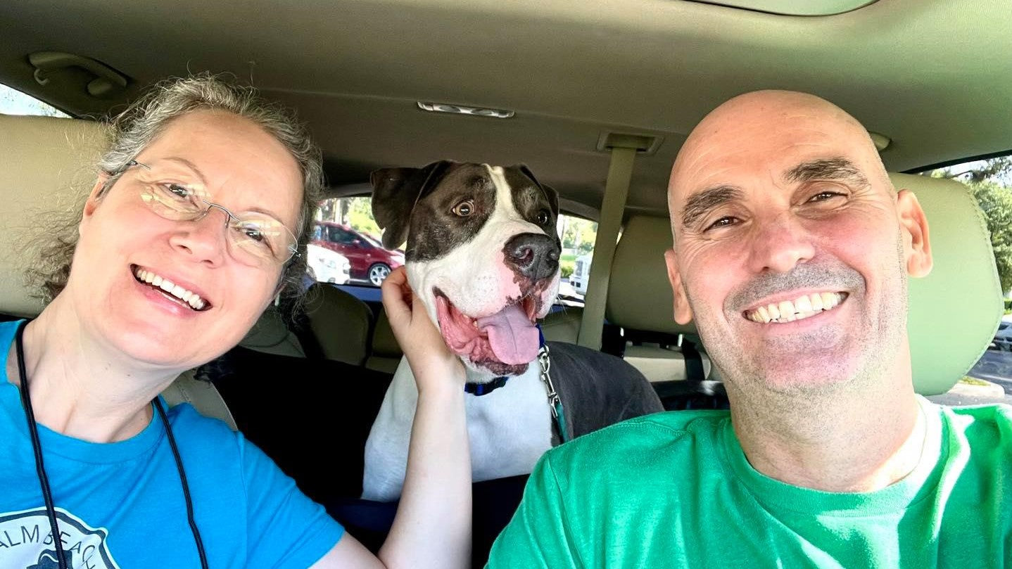 Lorrie Browne and Tim Chance of Palm Beach Shelter Dog Project with a dog being rescued from Palm Beach Animal Care and Control