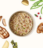 My Perfect Pet Specialty Blend Chicken gently cooked cat food served in a bowl with fresh vegetables and cranberries. Sold at Jake's Pet Supply Boca Raton Lake Worth