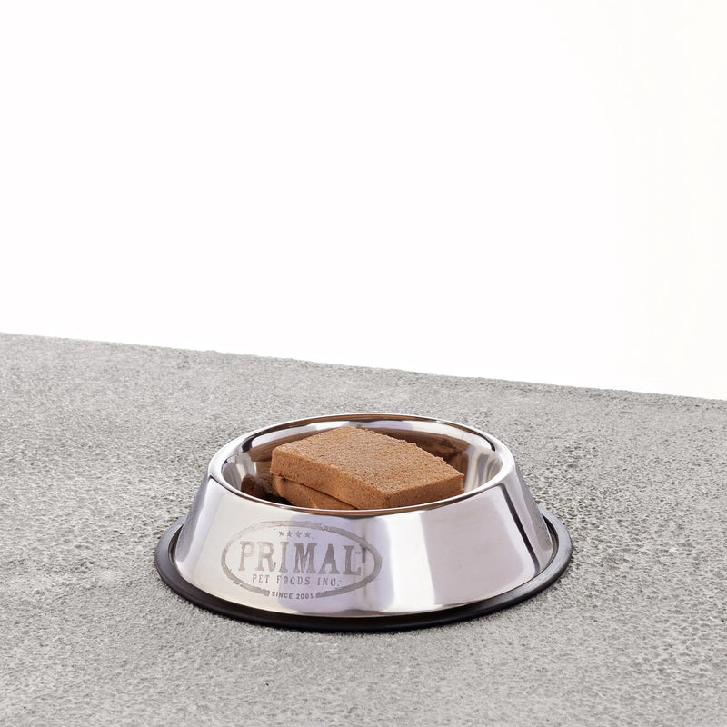 primal raw dog food patties in a bowl